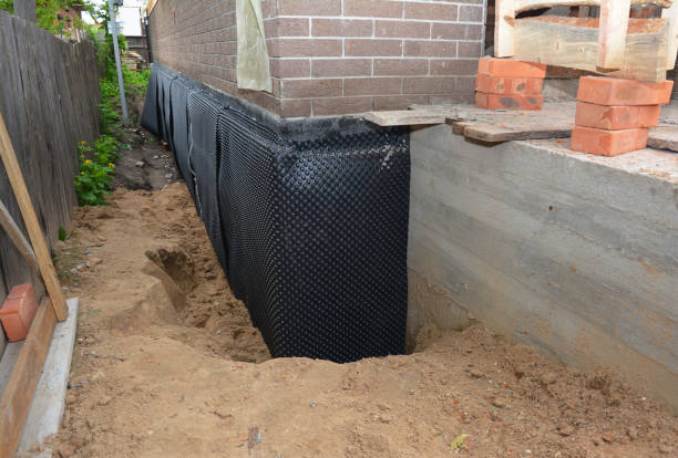 SJ Waterproofing Pros technician performing targeted Waterproofing assessment in New Hyde Park, NY